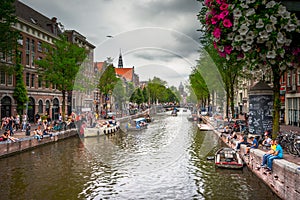 Amsterdam, with flowers and bicycles on the bridges over the canals, Holland, Netherlands.