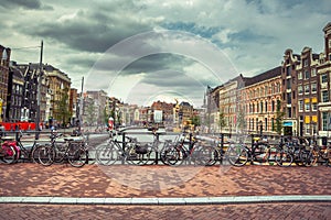 Amsterdam, with flowers and bicycles on the bridges over the canals, Holland, Netherlands.