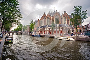 Amsterdam, with flowers and bicycles on the bridges over the canals, Holland, Netherlands.