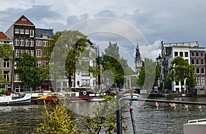 Amsterdam, Holland. August 2019. The large tourist boats that crowd the canals of the historic center: they move all day