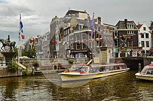 Amsterdam, Holland. August 2019. The large tourist boats that crowd the canals of the historic center: they move all day