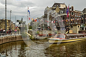 Amsterdam, Holland. August 2019. The large tourist boats that crowd the canals of the historic center: they move all day