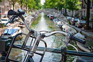 Amsterdam in Holland with its magnificent brunch breakfast canals, its levi barge bridge and traditional boat, flowery city bike