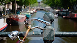 Amsterdam in Holland with its magnificent brunch breakfast canals, its levi barge bridge and traditional boat, flowery city bike