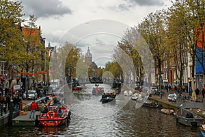 Canal of Oude Doelenstraat English: Oude Doelen street in the queen`s day in Amsterdam.