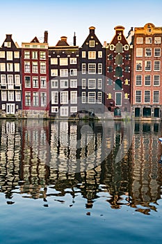 Amsterdam houses with colorful facades at the Amstel river canal