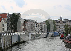 Amsterdam and the navigable canal called SINGEL with floating fl