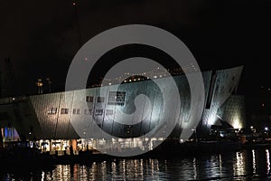 Amsterdam NEMO museum at night canal view