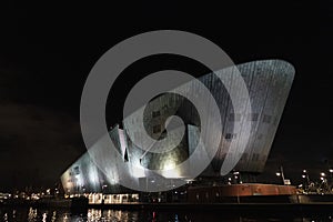 Amsterdam NEMO museum at night canal view