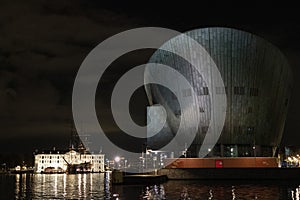 Amsterdam NEMO museum at night canal view
