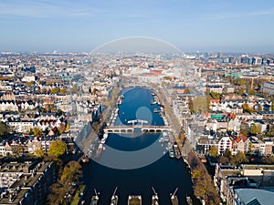 Amsterdam, The Netherlands, 7th November 2020 Aerial view of the Magere Brug Amsterdam And the river Amstel, City hall