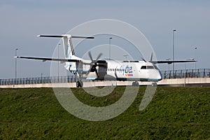 Flybe Bombardier DHC-8 Q400 G-KKEV passenger plane taxiing at Amsterdam Schipol Airport