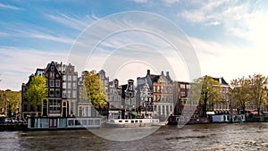 Amsterdam Netherlands city skyline time lapse at canal waterfront