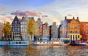Amsterdam Netherlands dancing houses over river Amstel. photo