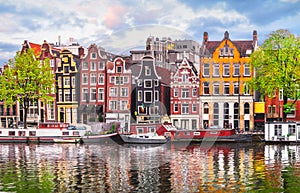 Amsterdam Netherlands dancing houses over river Amstel photo