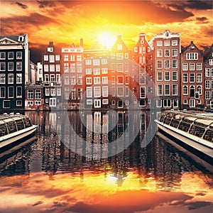 Amsterdam Netherlands dancing houses reflected in Amstel river at dramatic sunset, old european city