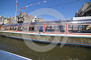 Excursion on a pleasure boat through the canals of Amsterdam