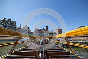 Tourists inside the pleasure boat in Amsterdam