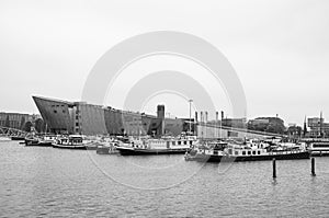 AMSTERDAM, NETHERLANDS. JUNE 06, 2021. Beautiful view to a shipping channel and bridges. Black and white photography