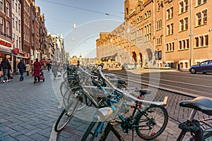 AMSTERDAM, NETHERLANDS - March 20, 2018 : Bicycles on the street of Amsterdam at sunny spring day.