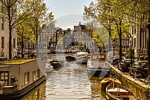 Amsterdam, Netherlands, May 2022. The dancing houses and the house boats at the Amstel river in Amsterdam
