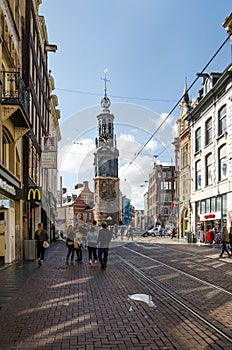 Amsterdam, Netherlands - May 8, 2015: People at The Munttoren (Mint Tower) Muntplein square in Amsterdam