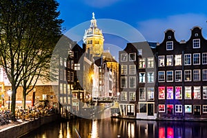 Amsterdam. Night view of Amsterdam cityscape with canal, bridge and typical Dutch Houses