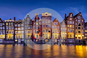 Amsterdam, Netherlands. View of traditional houses during sunset. The famous Dutch canals. A cityscape in the evening.