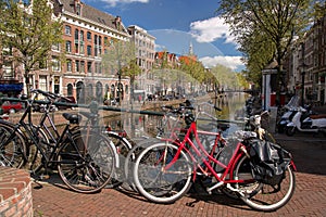 Amsterdam with old bikes on the bridge in Holland