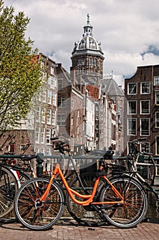 Amsterdam with old bikes on the bridge in Holland