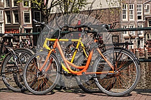 Amsterdam with old bikes on the bridge in Holland