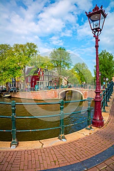 Amsterdam  - old houses, bridges, canals and lantern. View of the famous old center of Amsterdam. Amsterdam, Holland, Netherlands