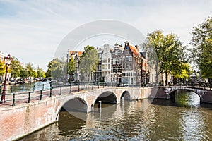 Amsterdam old town, Netherlands, charming street and canals. Popular travel destination and tourist attraction