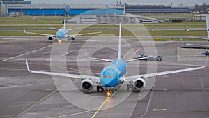 Amsterdam, Schiphol Airport. KLM Boeing 737 are moving to the runway