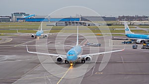 Amsterdam, Schiphol Airport. KLM Boeing 737 are moving to the runway