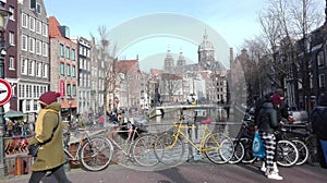 Amsterdam sightseeing tour. cold but sunny day, traditional bicycles on the Dutch canals. against the background classical