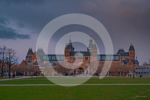 Amsterdam at summer night. Famous national Rijks museum general view at dusk