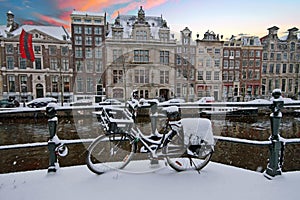Amsterdam in winter in Netherlands at sunset
