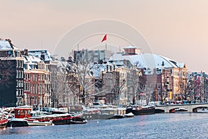 Amsterdam winter view with the river Amstel in front