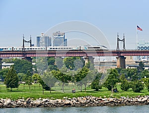 The Amtrak Acela Express heads north on elevated tracks over Randall`s Island in in NYC