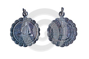 Amulets, Thai Buddha amulet, or votive tablet, made of metal or terracotta isolated on white background. The amulet is popular for