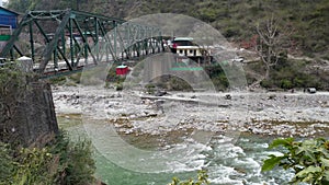 amuna Bridge spanning over the majestic River Yamuna amidst the breathtaking mountains of Uttarakhand, India