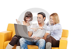Amused young people with laptop computer photo