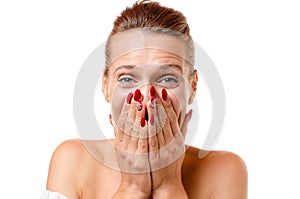 Amused young woman trying to stifle her laughter