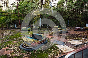 Amusement cars attraction in park in Pripyat. exclusion Zone of Chernobyl ghost city photo