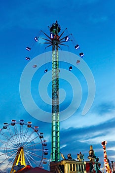 Amusement park on the background of the sunset.