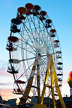 Amusement park on the background of the sunset.