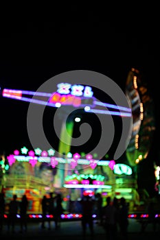 AMUSEMENT PARK at night in bokeh