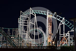 Amusement park rides at night photo
