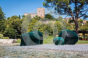 The amusement park in Santarcangelo di Romagna with the castle in the background, Italy